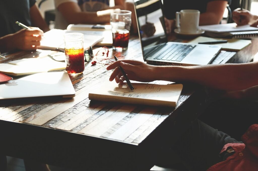 General Liability Insurance Cost for Small Business - team meeting in small office