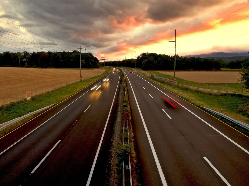 How to Lower Your Bill As Auto Insurance Rates Rise - car driving on highway