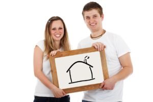 Mortgage Insurance Premium - couple signing mortgage papers
