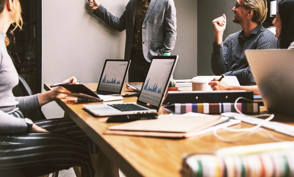 Small Business Insurance for Llc - team meeting in small office Small Business Insurance for Llc - team meeting in small office