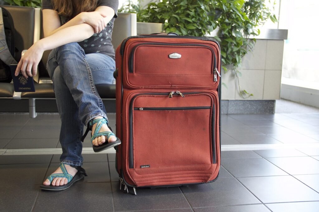 Travel Insurance International - traveler with suitcase at airport Travel Insurance International - traveler with suitcase at airport